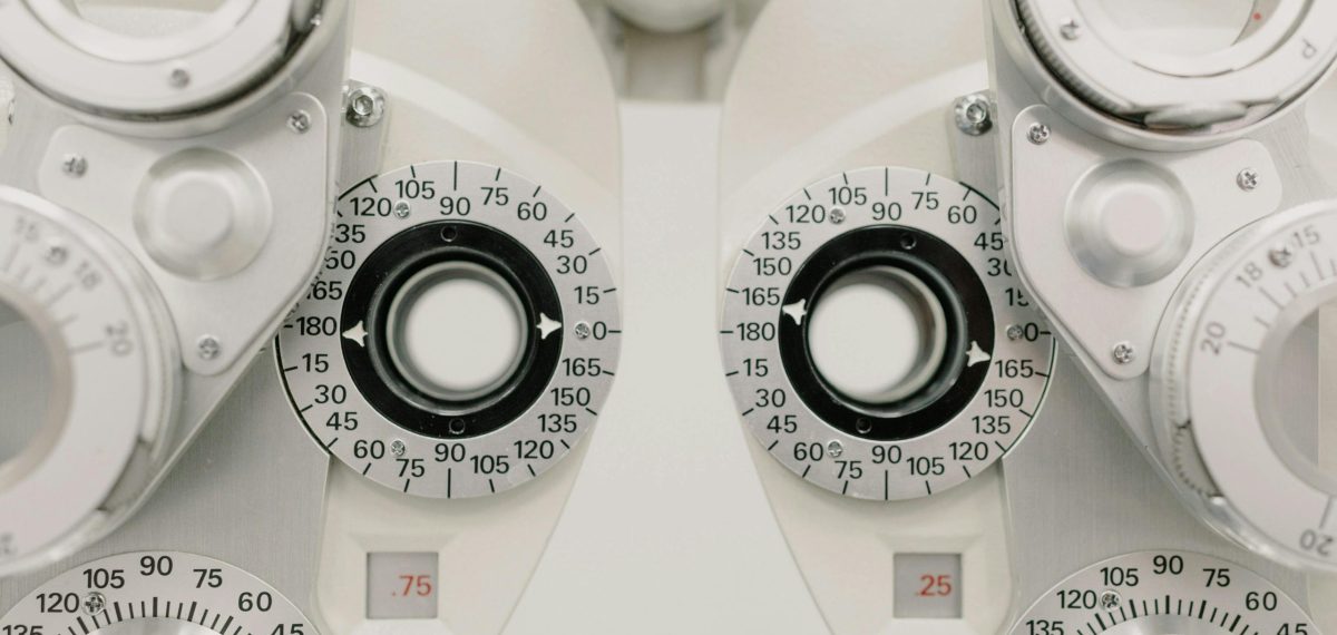 Detailed view of a phoropter used for precise eye exams in a clinical setting.